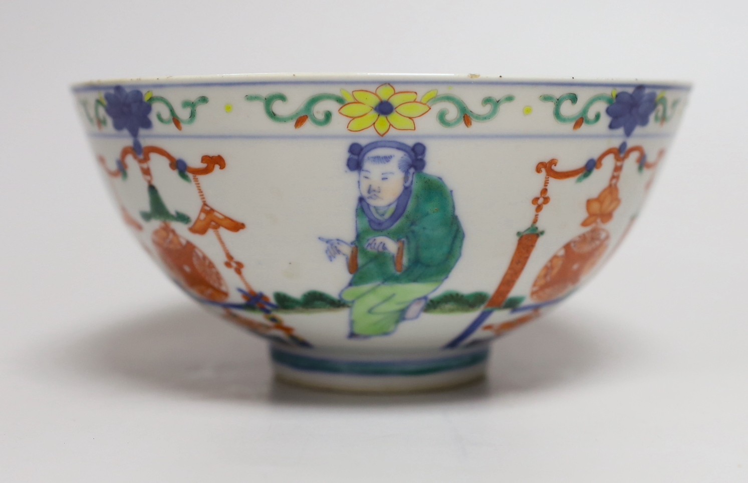 A Chinese wucai ‘boys’ bowl, Kangxi mark late 19th/early 20th century, dragon to the interior, 16.5cm diameter